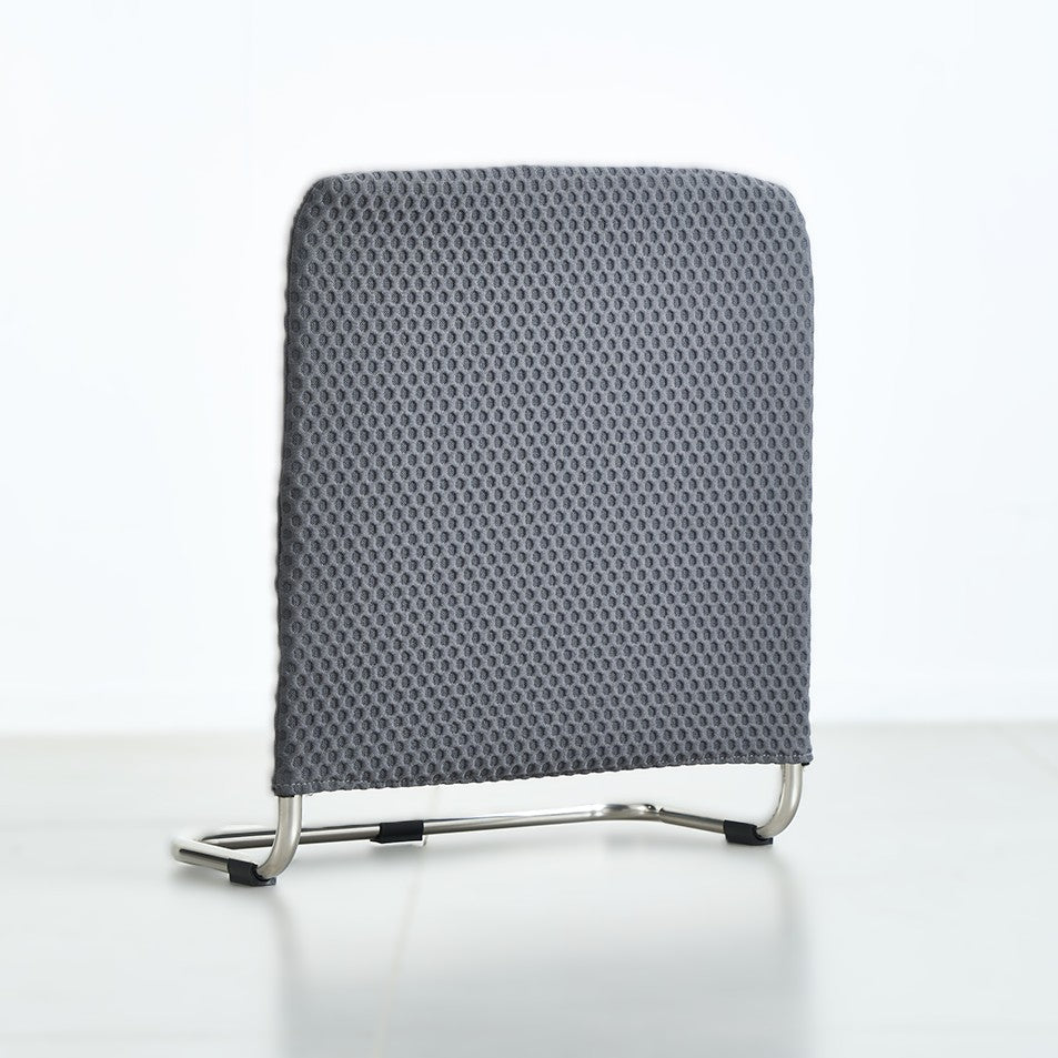 Gray supporting bar with a patterned backrest on a gray background