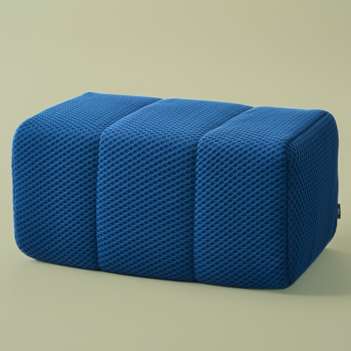 Blue textured Ottoman on a beige background