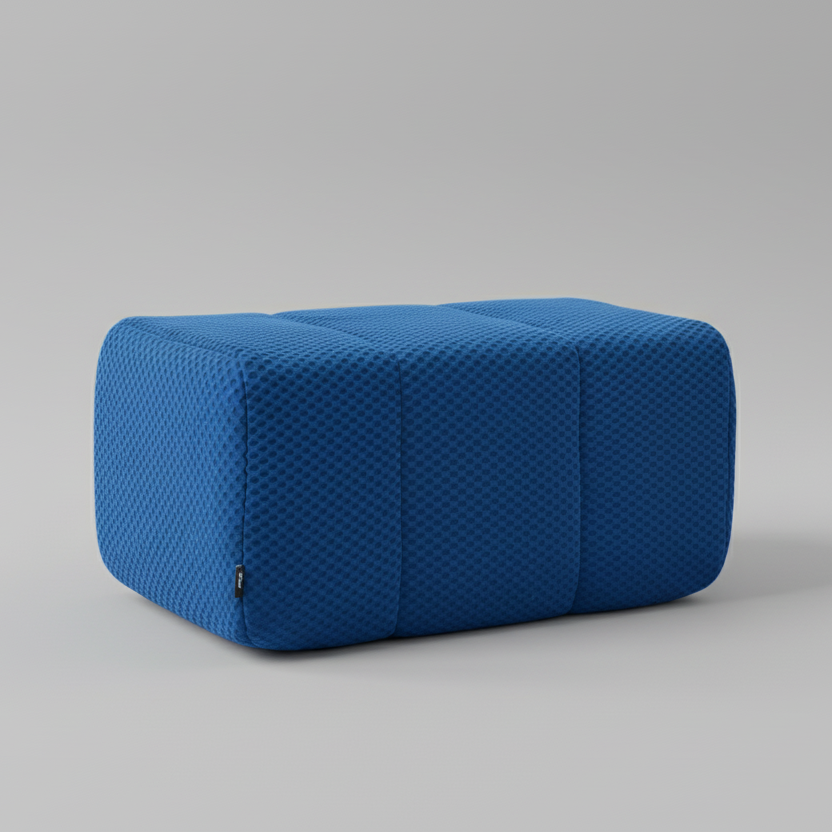 Blue textured pillow on a gray background