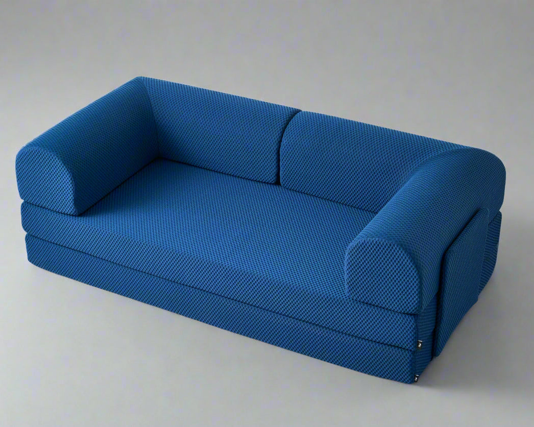 Blue textured three sit sleeping sofa on a light gray background