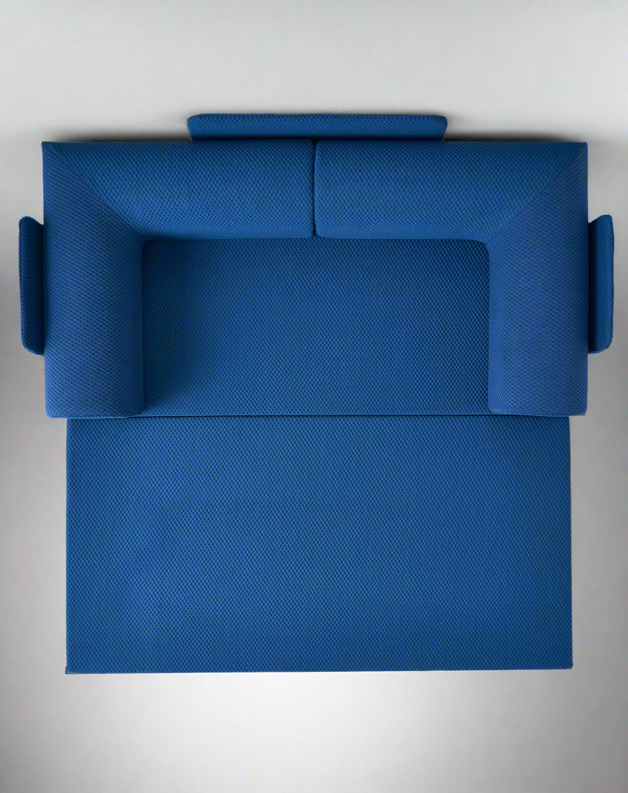 Top view Blue textured three sit sleeping sofa on a light gray floor