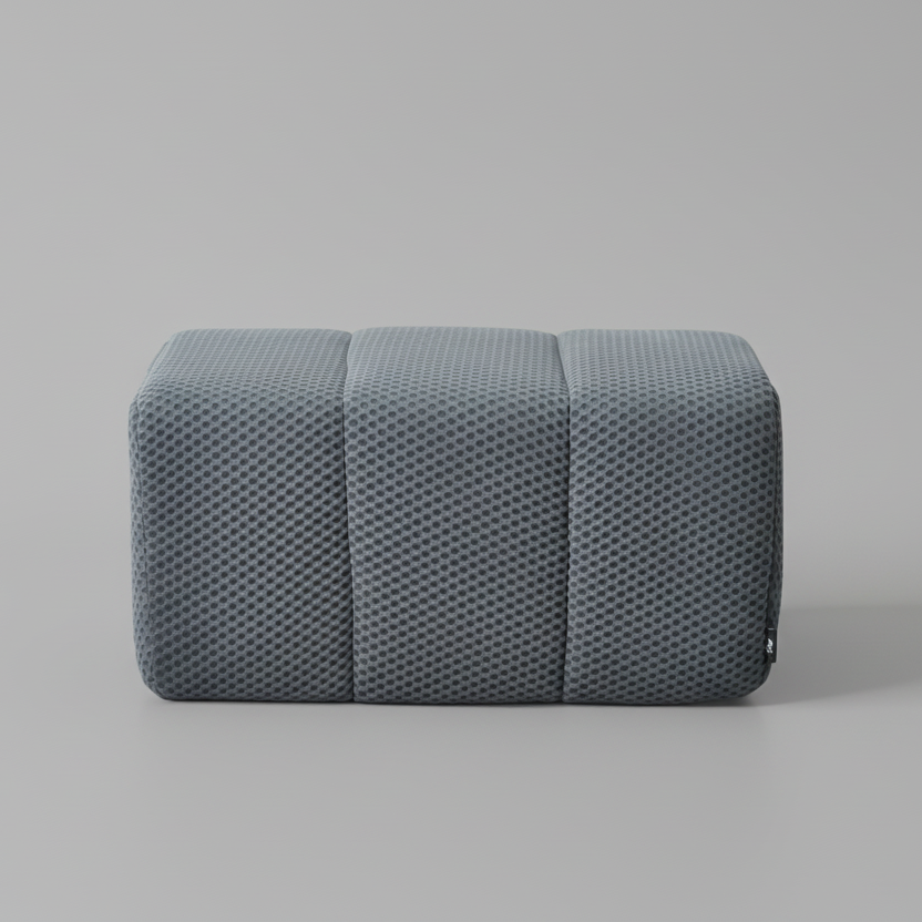 Gray textured Ottoman on a gray background