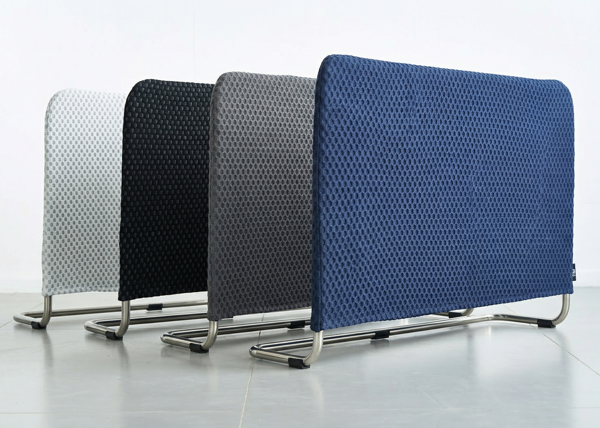 Four wide supporting bars with textured backs in different colors on a white background