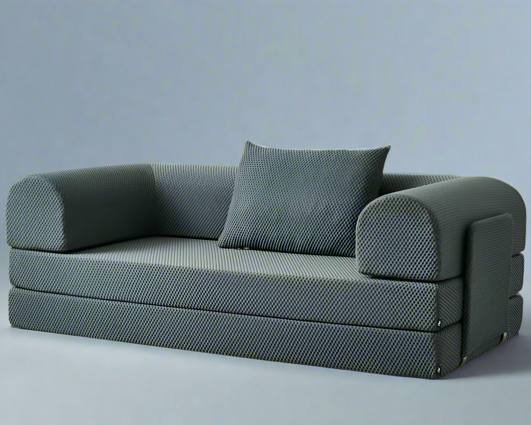 Gray sofa bed on a white floor with a white wall background