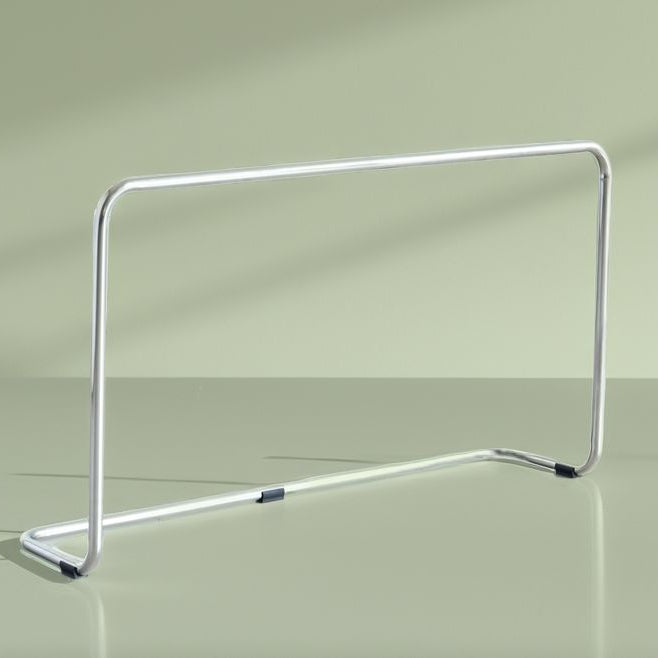 Wider Sofa Supporting Metal stand on a reflective surface with a light green background