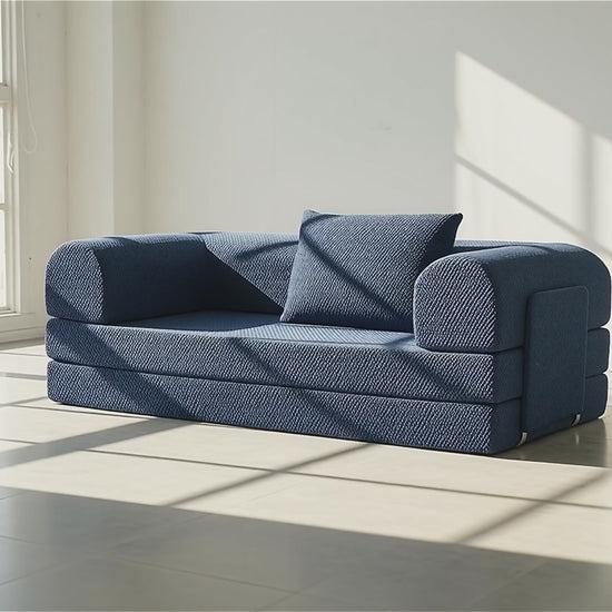 video of a woman check her phone on a  three sit sleeping sofa